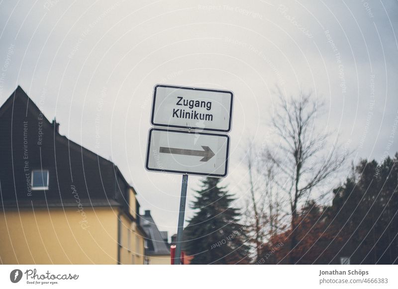 Access to clinic Signpost with arrow pointing to the right Clinical Center Hospital Road marking sign Road sign Arrow Right Direction Sick Nursing