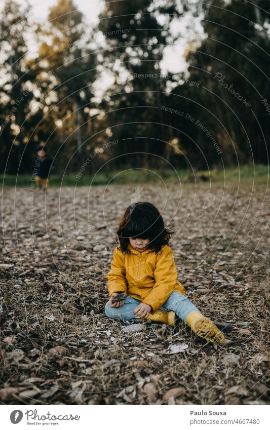 Cute girl playing outdoors Girl Child 3 - 8 years Caucasian Multicoloured Exterior shot Happy Human being Day Joy Nature Happiness Infancy Colour photo Yellow