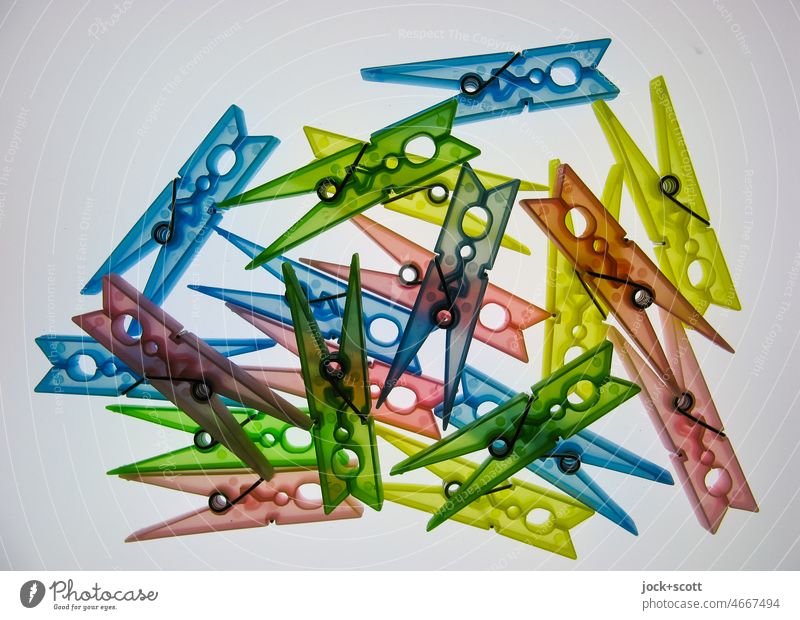 a pair of colored plastic clothespins Clothes peg Untidy Collection Equal X-rayed Accidental Multicoloured Abstract Structures and shapes Lightbox