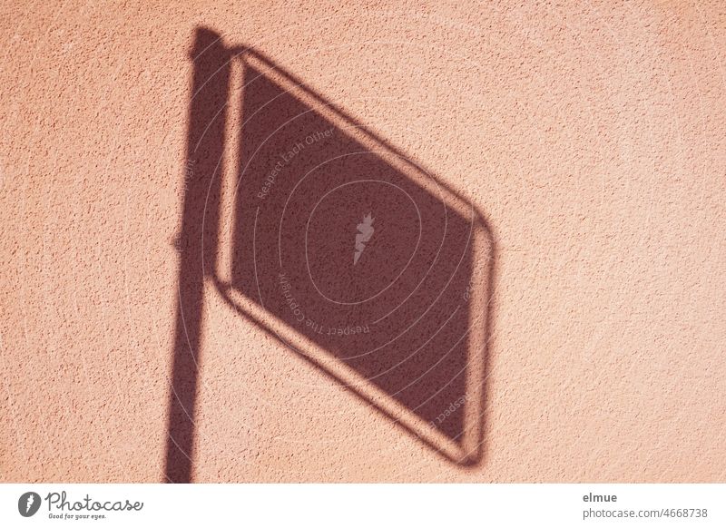 Shadow of a sign with metal bar on an old pink wall / shadow play / abstract Shadow play Wall (building) Building Facade dusky pink shadow cast