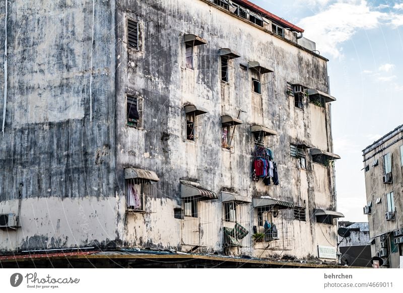 color reduced | crumbling facade Deserted Exterior shot Colour photo Facade Gloomy Architecture City life Life form Exceptional Window Balcony Wall (building)