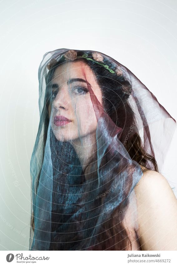 young woman with veil and flower crown Photo idea Beauty Photography pretty Face of a woman Artistic Looking into the camera melancholy Feminine Young woman