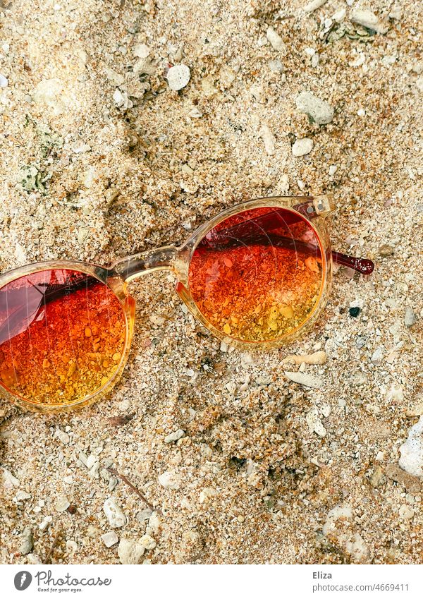 Colorful sunglasses in the sand on the beach. Summer and vacation. Sunglasses Beach variegated Color gradient Yellow Sand Summer vacation Sunlight
