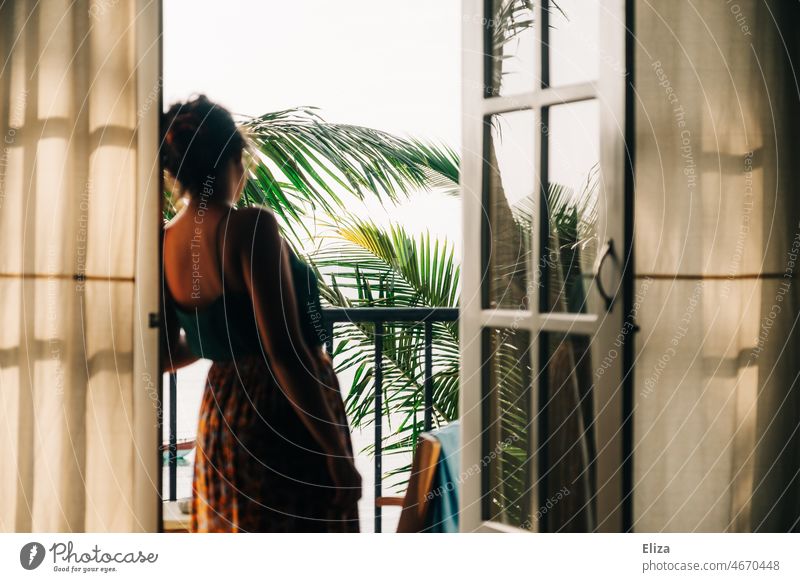 Woman standing in open balcony door looking at palm trees palms Balcony vacation Accommodation Vacation & Travel French windows Open outlook Exotic relaxed