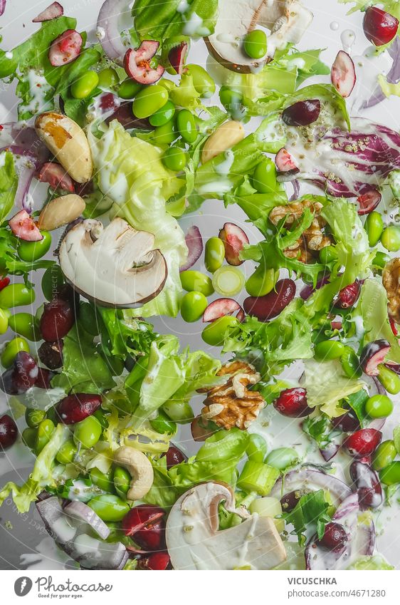 Salad background with mushrooms, edamame, kidney beans, onion and nuts salad healthy green vegan food vitamins protein balanced eating top view close up