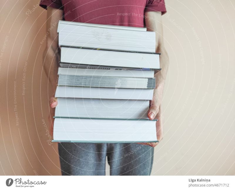 Arms holding stack of books Book Education Reading pile of books Reading matter Stack Literature Paper Information Novel Library Study Know Academic studies Old