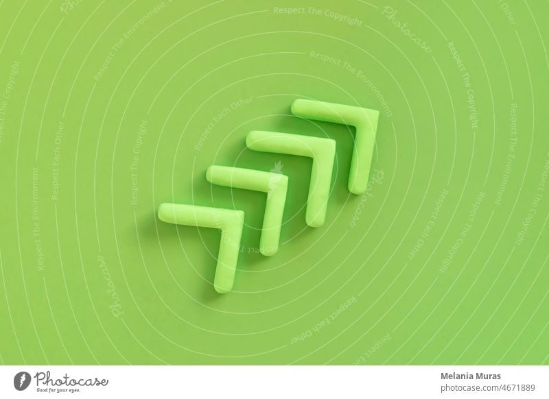 Arrows pointing up, green color. Concept of development, profit, progress. Arrow upwards show growing of the business, success of ecological marketing. abstract