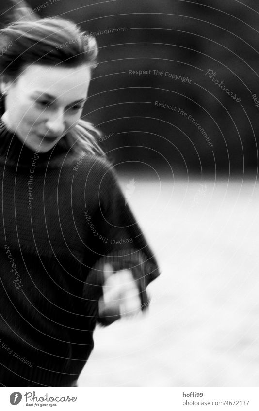 blurred portrait of woman with motion blur and blowing hair Movement Strand of hair Face of a woman Adults Walking Feminine Young woman Black & white photo