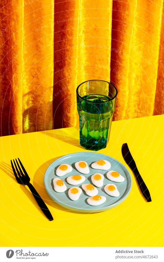 Plate with jelly eggs yellow table plate fork nutrition food napkin boiled meal ingredient healthy sweet marmalade tasty fresh bright dish organic natural