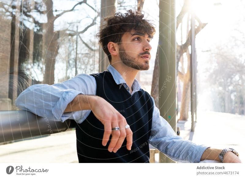 Serious Hispanic man on street style city elegant appearance apparel thoughtful outfit urban male confident hispanic handsome beard calm trendy mustache