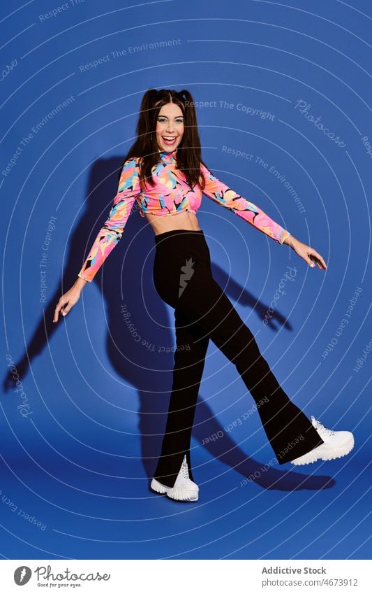 Happy woman in trendy outfit makeup style fashion design apparel carefree having fun feminine lady optimist light positive charming glad cheerful studio attire