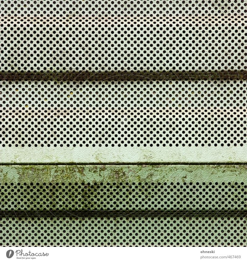 pitting corrosion Deserted Wall (barrier) Wall (building) Facade Plate with holes Tin Gloomy Green Verdigris Hollow Colour photo Subdued colour Exterior shot