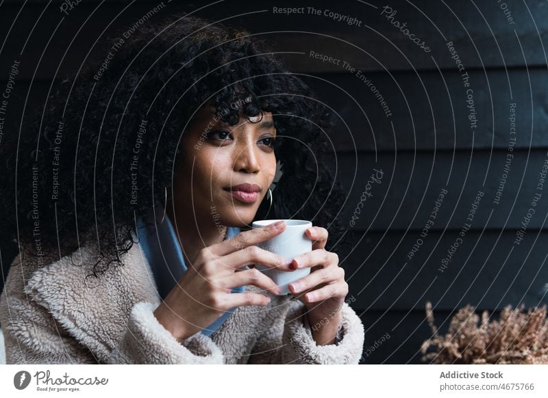 Black woman with cup of coffee drink relax rest house home chill coffee break warm female african american woman black woman mug hot drink beverage curly hair