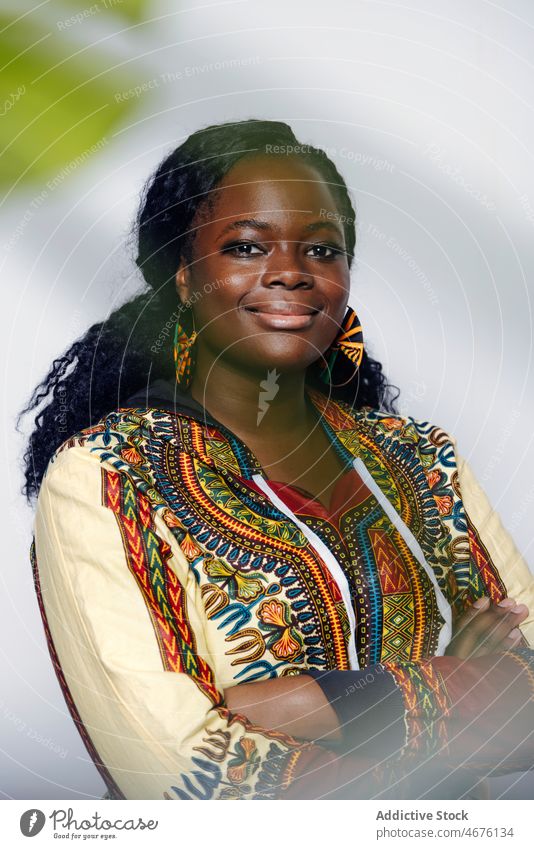Happy curvy woman in stylish african outfit female style smile trendy happy positive confident glad young culture delight appearance portrait content hairstyle
