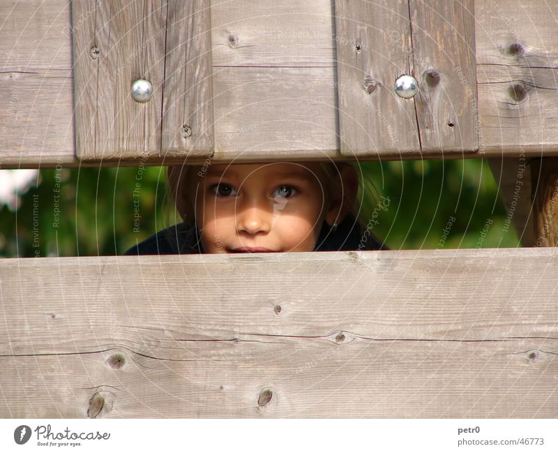 Find me! Girl Child Playground Wood Wooden board Face Eyes Hiding place Looking