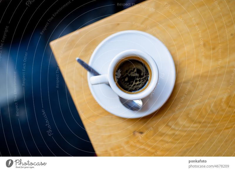 Cup of espresso on a wooden table in a cafe from above Espresso Coffee Coffee break Wooden table Café