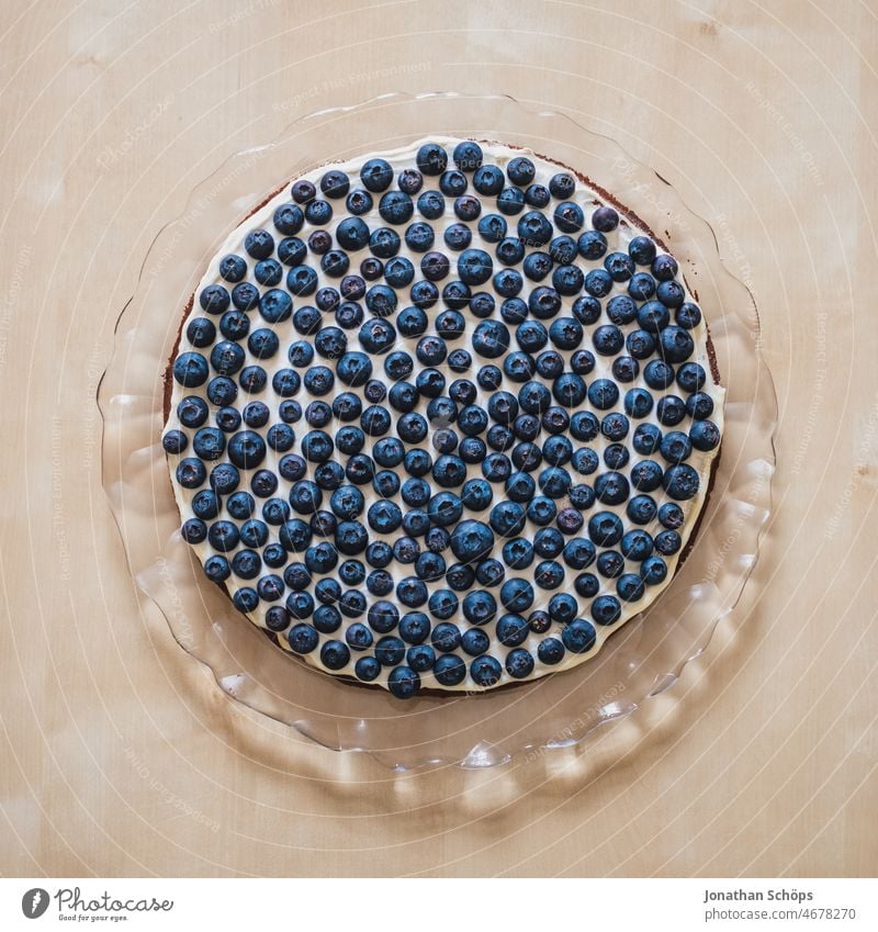 Blueberries on cream cake on glass cake plate Blueberry blueberries fruit Berries salubriously antioxidants vitamins Food Delicious seasonal Fresh Fruit