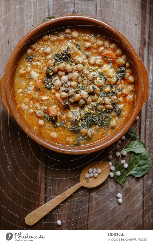 Vegan food north Spain food. Chickpeas with chard. Potaje is a typical Spanish dish. vertical vegan stew chickpea cooked traditional homemade spanish spinach