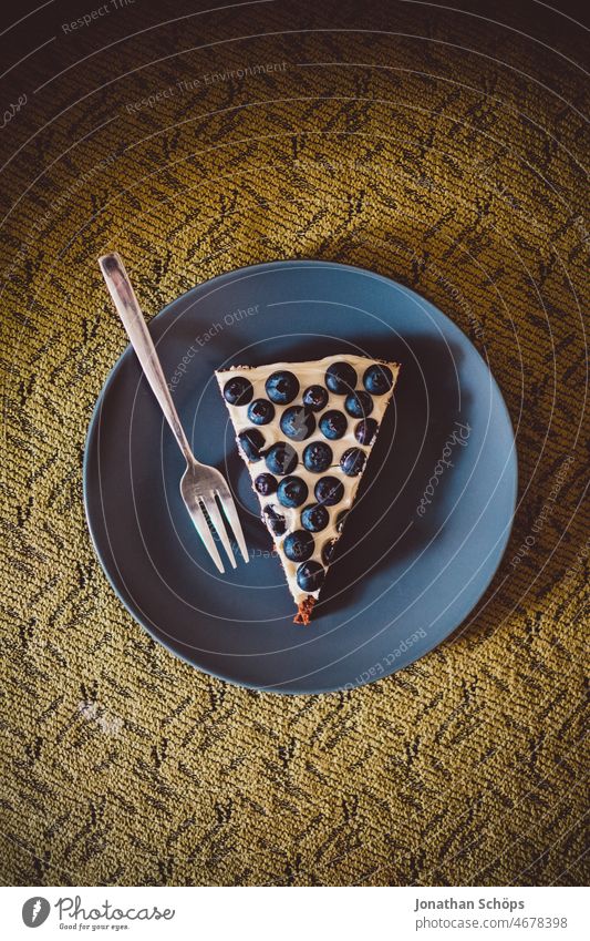 Blueberry cake slice with cake fork on plate on sofa blueberries fruit Berries salubriously antioxidants vitamins Food Delicious seasonal Fresh Fruit Nutrition
