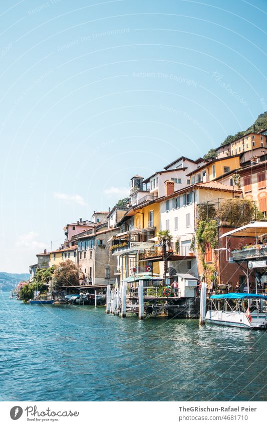 Village on the lake shore bank Ticino Lake Lugano Switzerland houses Morcote Water boat romantic Beautiful weather