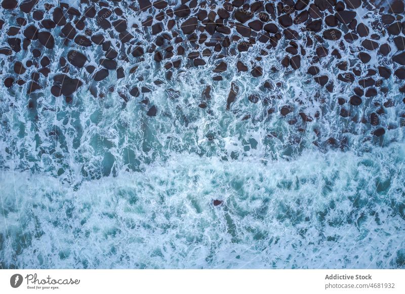 Majestic waves of powerful ocean crash storm background water coast shore wild remote foam scenic dark seascape dash tide splash cliff seashore abstract surface