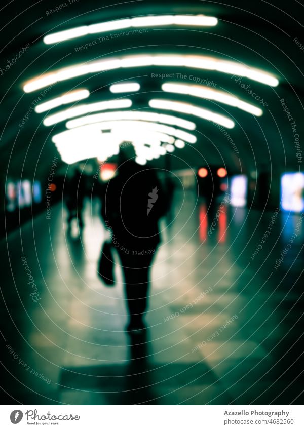 Blurry image of a platform with passengers waiting for the train. abstract arrival background black and white blur blurred blurry boy carriage color dark