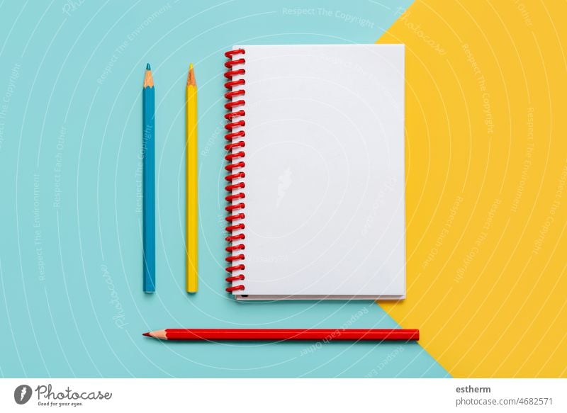 Spiral notebook with colored pencils and with copy space for your image or text spiral notepad back to school education memo pages college palette rainbow