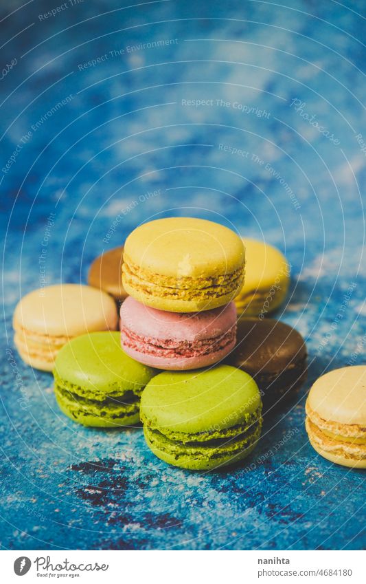 Variety of colorful macarons over a blue background macaroons gourmet food delicious sweet tasty delicatessen dessert cake bake bakery modern stylish food yelow