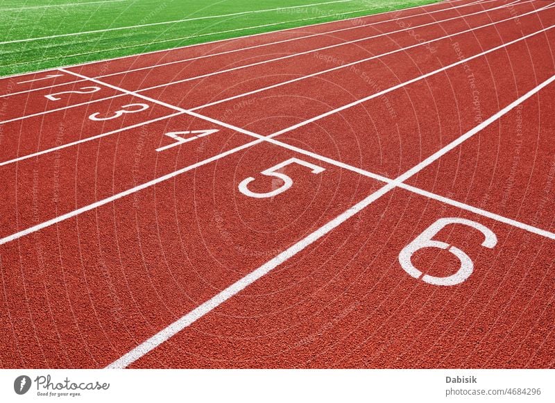 Red running track at stadium with lane numbers jogging treadmill sport fitness healthy care athlete race finish ground start line sprint training red course