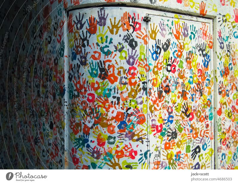 Hand for hand on wall with door hands Street art Imprint Many Teamwork Play of colours Creativity Abstract Agreed Decoration Silhouette Background picture