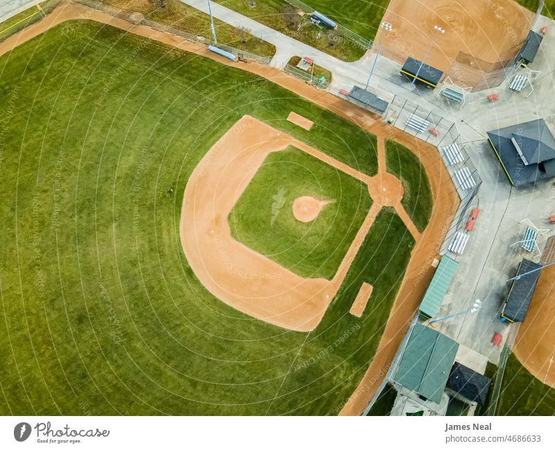 The baseballe fields at the local park are ready grass autumn sunny grassy bases nature city turf brown angle lawn summer drone outside scenic dirt seasonal