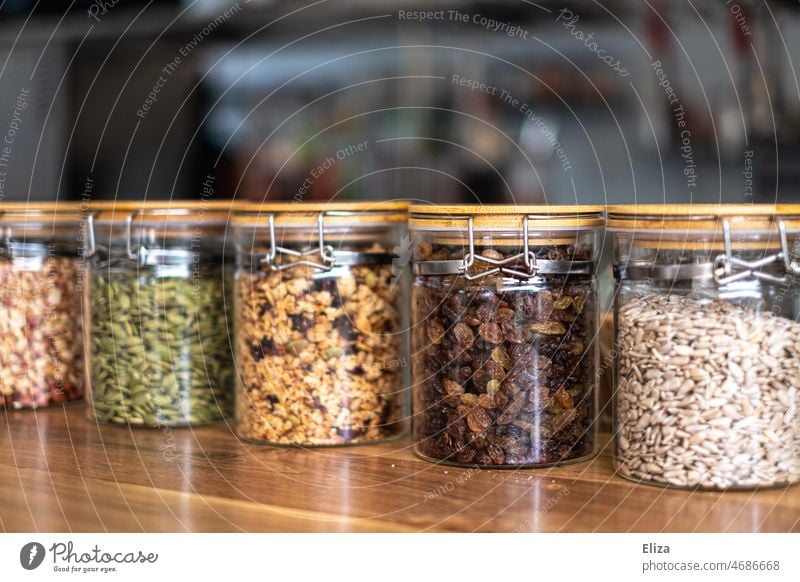 Food in storage containers Storage tank storage glass Containers and vessels Raisins Toppings unpacked Glass Glass container Nutrition plastic-free Ecological