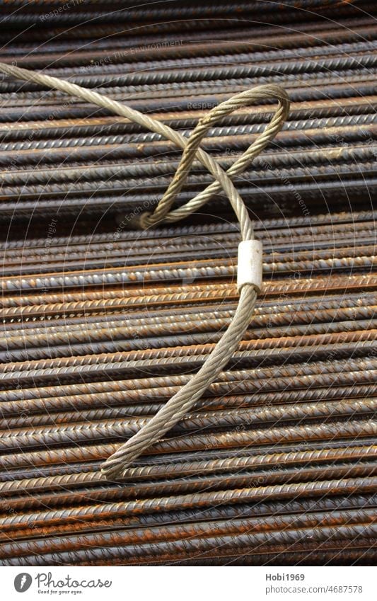 Construction steel was unloaded at a construction site with the help of a metal sling Metal sling Band Construction site Steel Iron Reinforcement Concrete noose