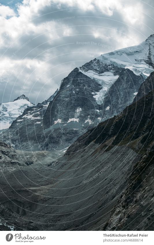 Mountain with glacier Snow Glacier Switzerland valais Clouds mountain stones roar Hiking Tourism