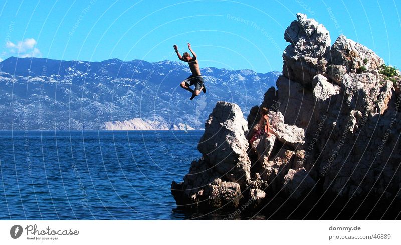the jump Jump Man Ocean Croatia Clouds Hand Dangerous Rock Stone Adriatic Sea sky summer Sun Blue Legs Flying Threat