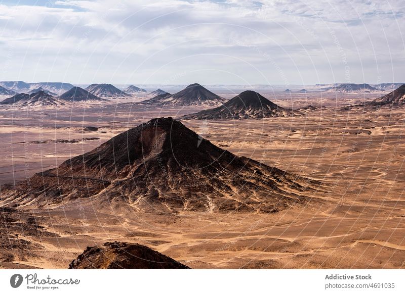 Black desert with mounds in Egypt black desert arid nature national landscape dry sand heat location destination scenery egypt africa famous shape soil rough