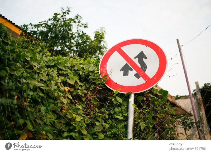 No Passing Road Sign in Indonesia sign road traffic symbol safety transportation caution street drive law warning danger road sign travel information pass speed