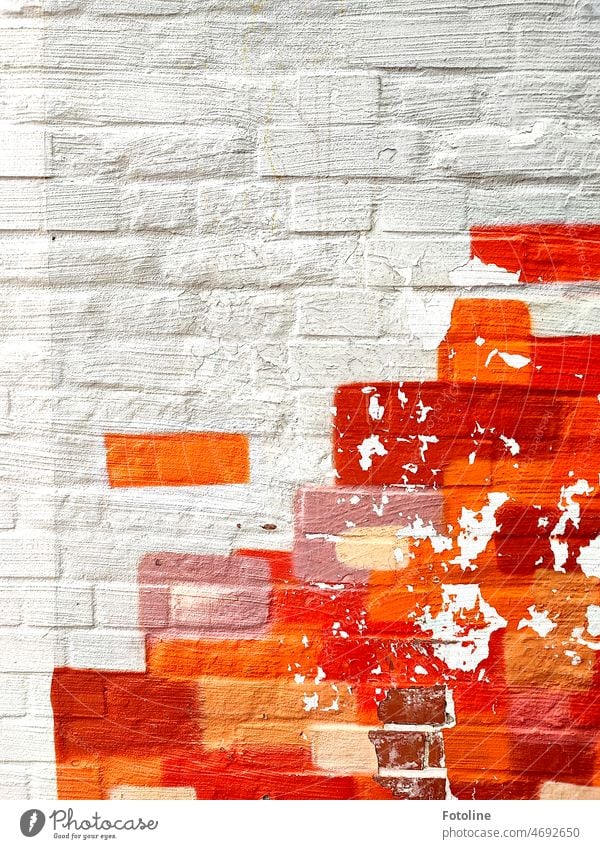 Orange, pink, brown and red color on white painted bricks. Colour Exterior shot Wall (building) Colour photo Facade Red Wall (barrier) Art painting colored