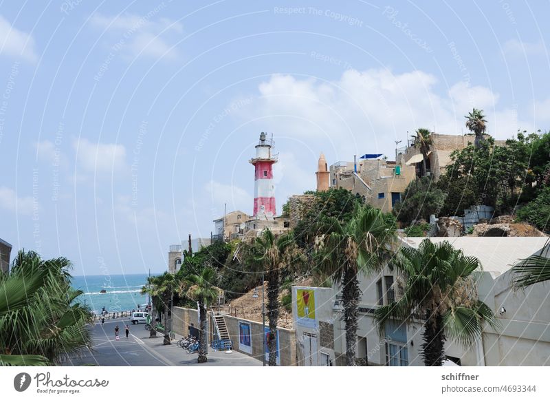 View of the Jaffa lighthouse Tel-a Israel Lighthouse Old town Port City Promenade Mediterranean sea palms Ocean