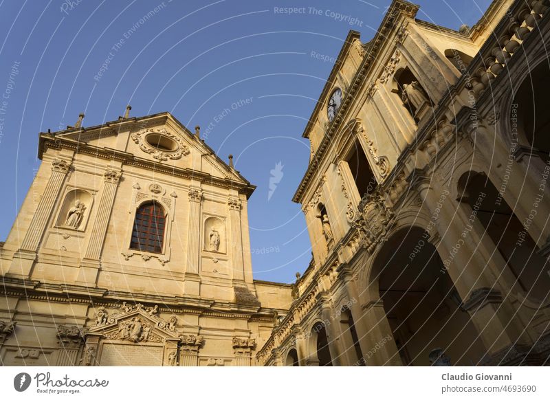 Lecce, Apulia, Italy: historic buildings in the cathedral square Europe Puglia ancient architecture baroque city cityscape color day door exterior facade old