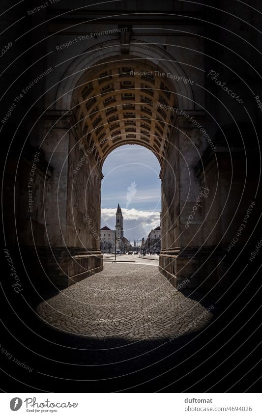 View through an archway in Munich Siegestor Victory Gate peace Goal Architecture Vista Bavaria Street view from below Ground Blue sky Landmark Town Downtown