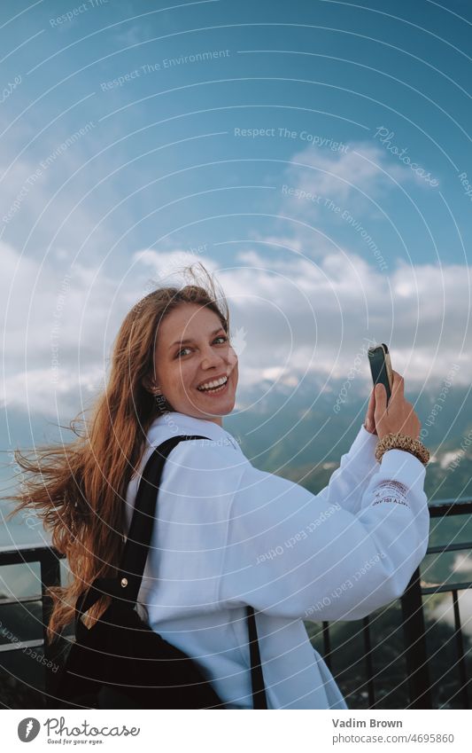 girl taking photo in the mountain woman phone beauty mobile people person smiling camera smile nature outdoors holding cellphone technology communication park