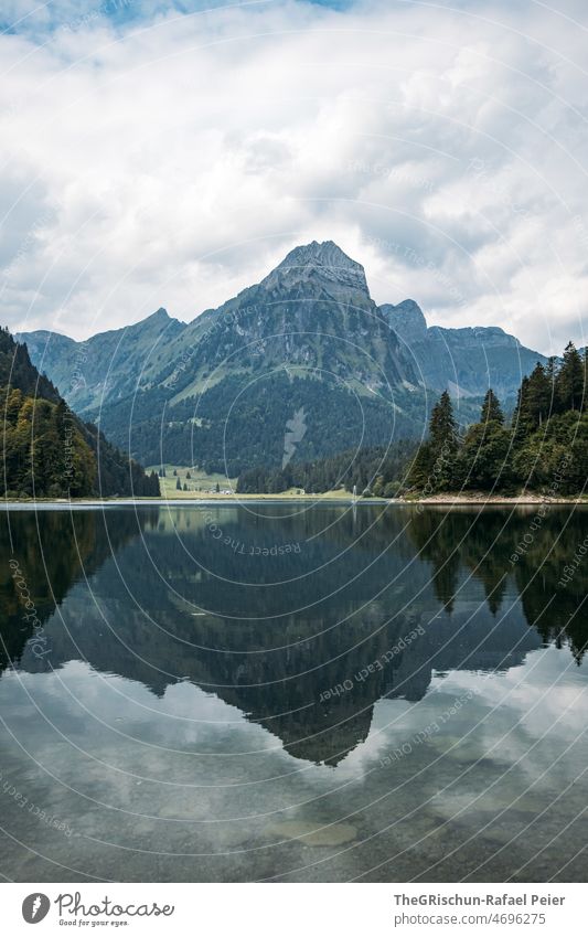 Lake before mountain Lake Obersee Glarus Water Tourism Switzerland Mountain Alps Landscape Exterior shot Blue Rock Hiking Deserted reflection crystal clear