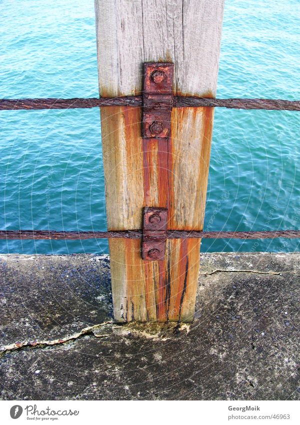 vapid Ocean Wood Iron Footbridge Whitby England Jetty Wood flour Rust Nail Red Water wry Stone sea timber way Old Beautiful Blue