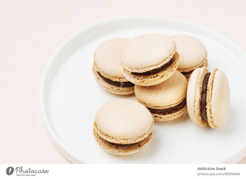 Coffee macaroons served on plate macaron coffee dessert sweet confection confectionery indulge treat food flavor fresh tasty delicious yummy appetizing french