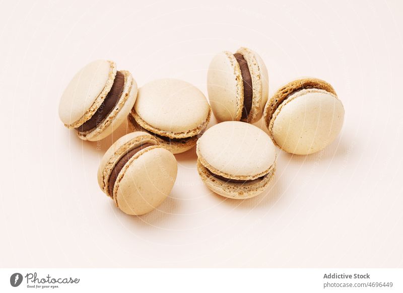 Coffee macaroons served on light background macaron coffee dessert sweet confection confectionery indulge treat food flavor fresh tasty delicious yummy
