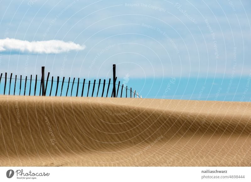 On the beach Beach Sand dunes Fence Fence post Ocean seascape Sky Sky blue Horizon Horizon above the water Stripe Water Moody nature photography