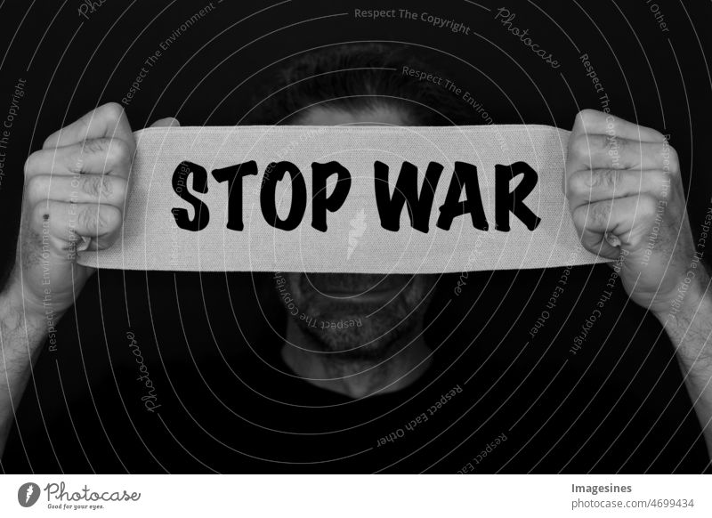 STOP WAR. Man with banner in hand. Military conflict between Russia and Ukraine. more adult succor bandage Banner - sign Blindfold business communication