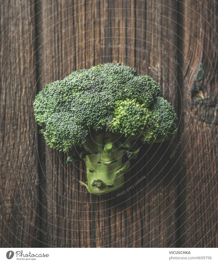 Close up of whole green broccoli at brown rustic wooden background close up organic vegetable healthy lifestyle top view closeup food fresh freshness garden