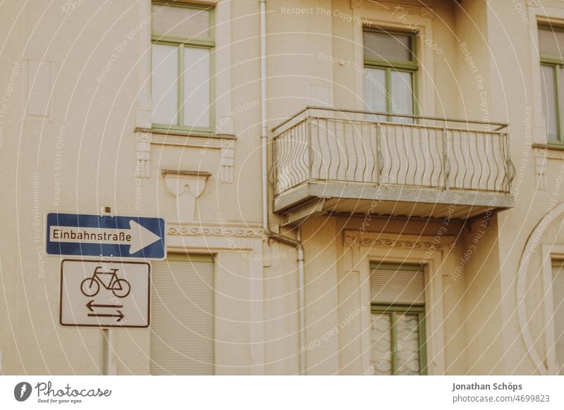 One way street sign in front of facade One-way street one-way street sign Road sign House (Residential Structure) Facade Analog Retro Cycling Cycle path Balcony